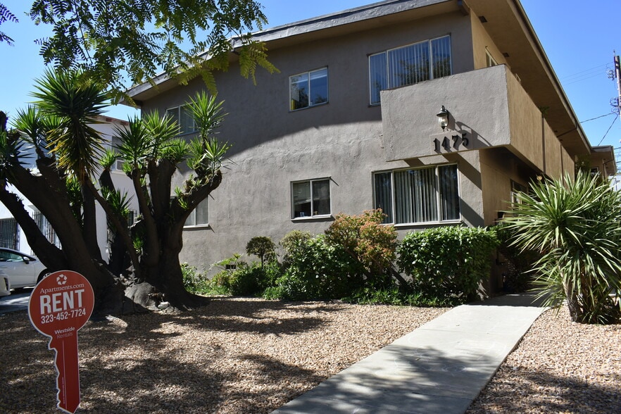 Front of building featuring yucca trees - 1475 S Wooster St