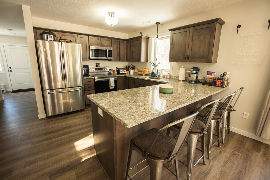 View of Kitchen with Bar Seating - 2927 Marshall St NE