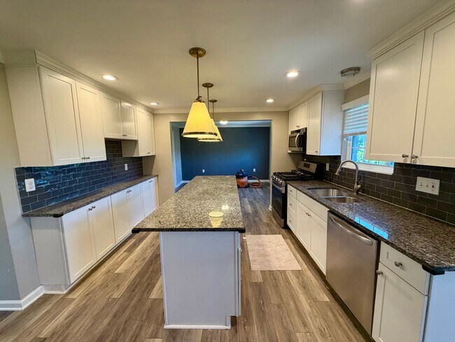 Building Photo - Modern Comforts Await: Spacious Rental with 2-Car Garage, Private Office, and Finished Basement w...
