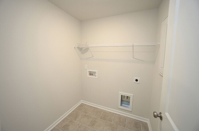 Building Photo - Beautiful 3 Bed+Bonus+2 Car Garage Townhome in New Wake Forest Community