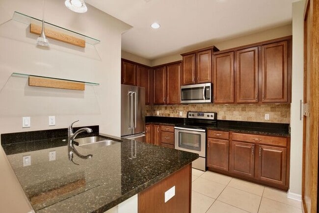 Building Photo - Gorgeous 4/2.5 Spacious Townhome with a Loft Area and a 2 Car Garage in the Desirable Gated Commu...