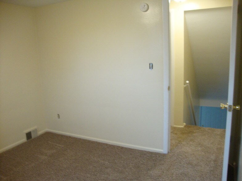 Second bedroom, hallway door on right. - 2085 Revere Dr
