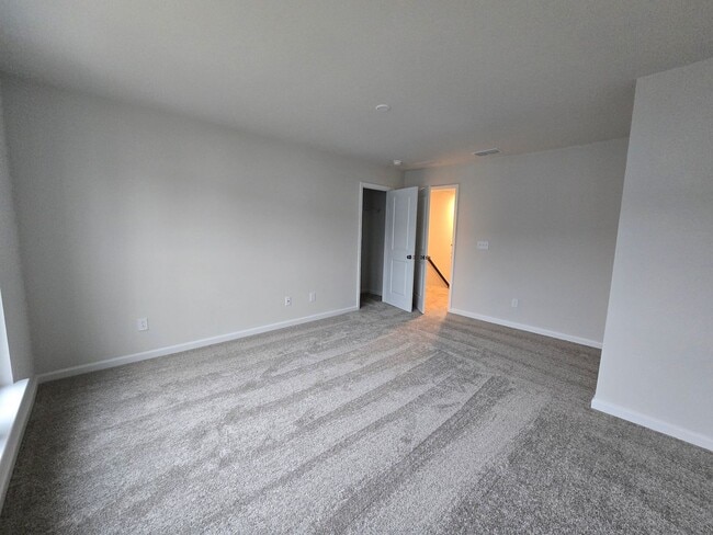 Building Photo - NEWLY BUILT END UNIT TOWNHOME