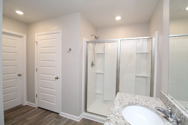 Building Photo - Coming Available Soon – 4BR/2BA Brick Home with Open Floor Plan, Solar Panels & 2-Car Garage in L...