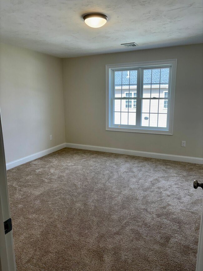 Building Photo - Brand New Townhouse-Style Living with Modern Finishes