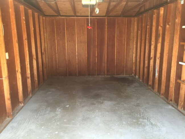 Building Photo - Updated two bedroom duplex, new stainless steel appliances, garage, and hardwood floors