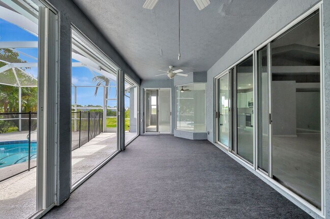 Building Photo - A BOATER'S PARADISE WITH THIS STUNNING 3 BEDROOM, 2 BATH WATERFRONT POOL HOME W/DOCK & BOAT LIFT ...
