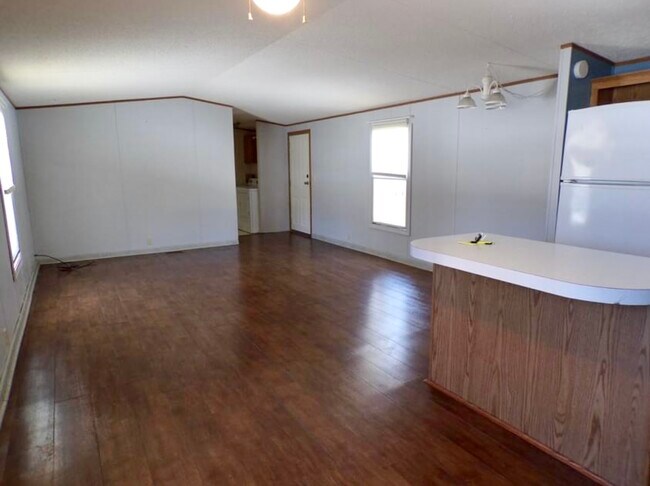 Living room adjoining kitchen space. - 16314 County 6