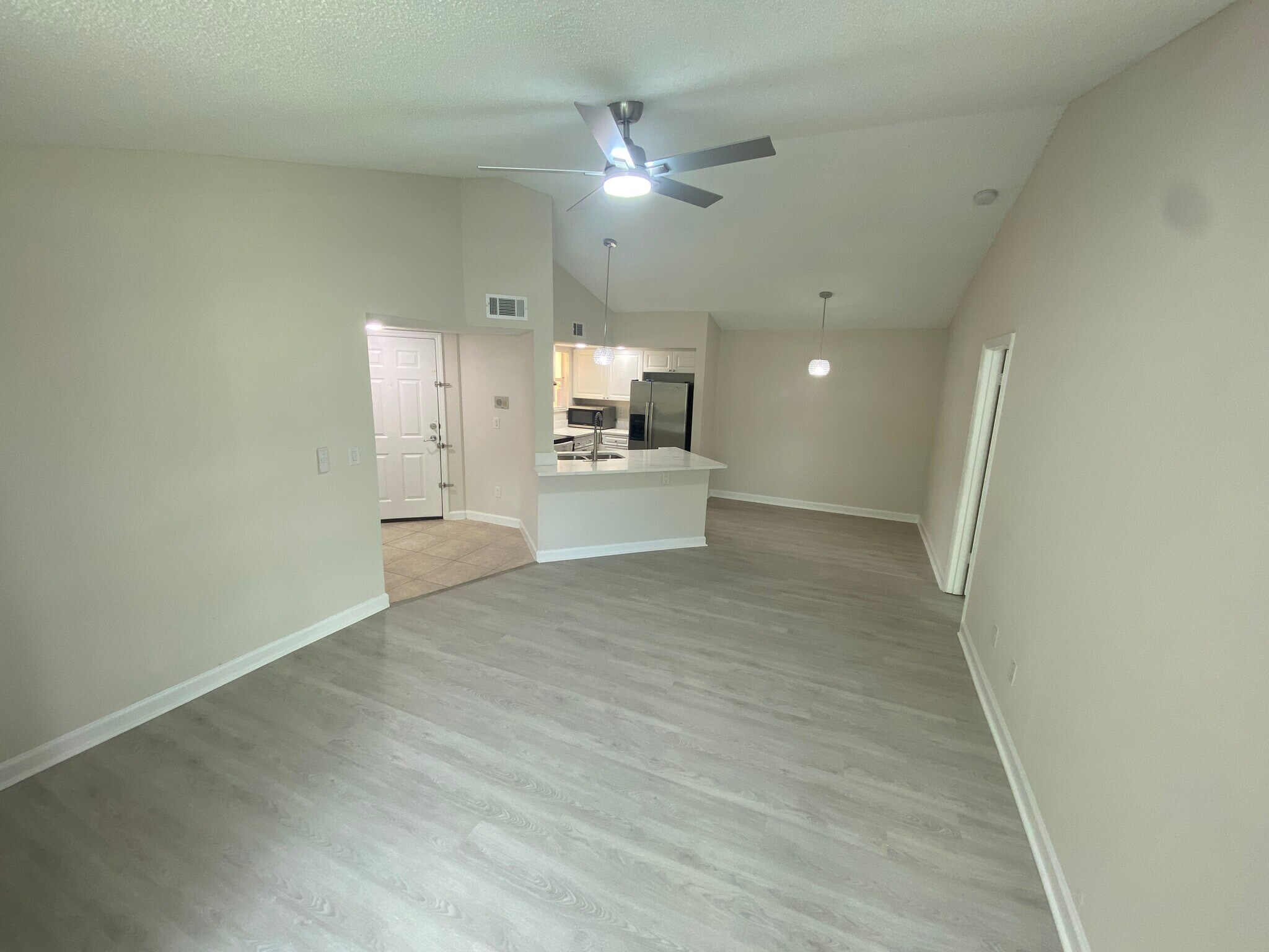 Living Room with Dining Area and Kitchen - 4512 Commander Dr