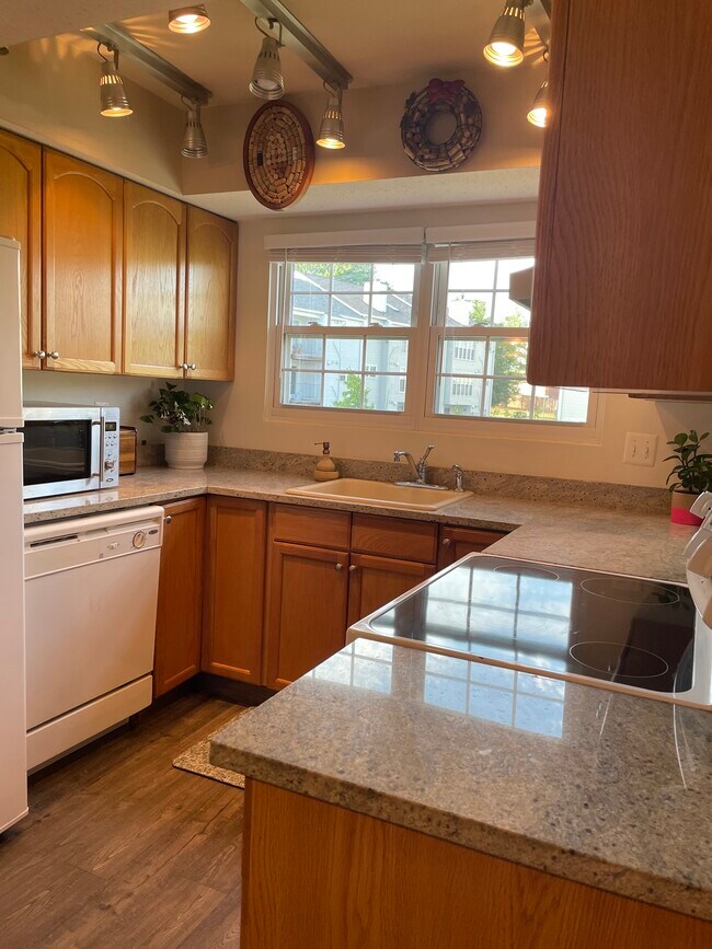 Kitchen with Refrigerator, Dishwasher, Stove, and in sink Disposal - 108 Prosperity Ave SE