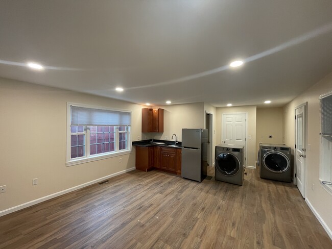 Kitchenette with 2 burner cooktop and refrigerator - 207 Market St