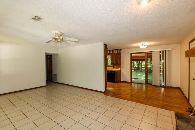 Building Photo - Two Bedroom, 2 Bath, 1-Car Garage, 1179 sq ft feet home with wood burning fireplace. and screened...