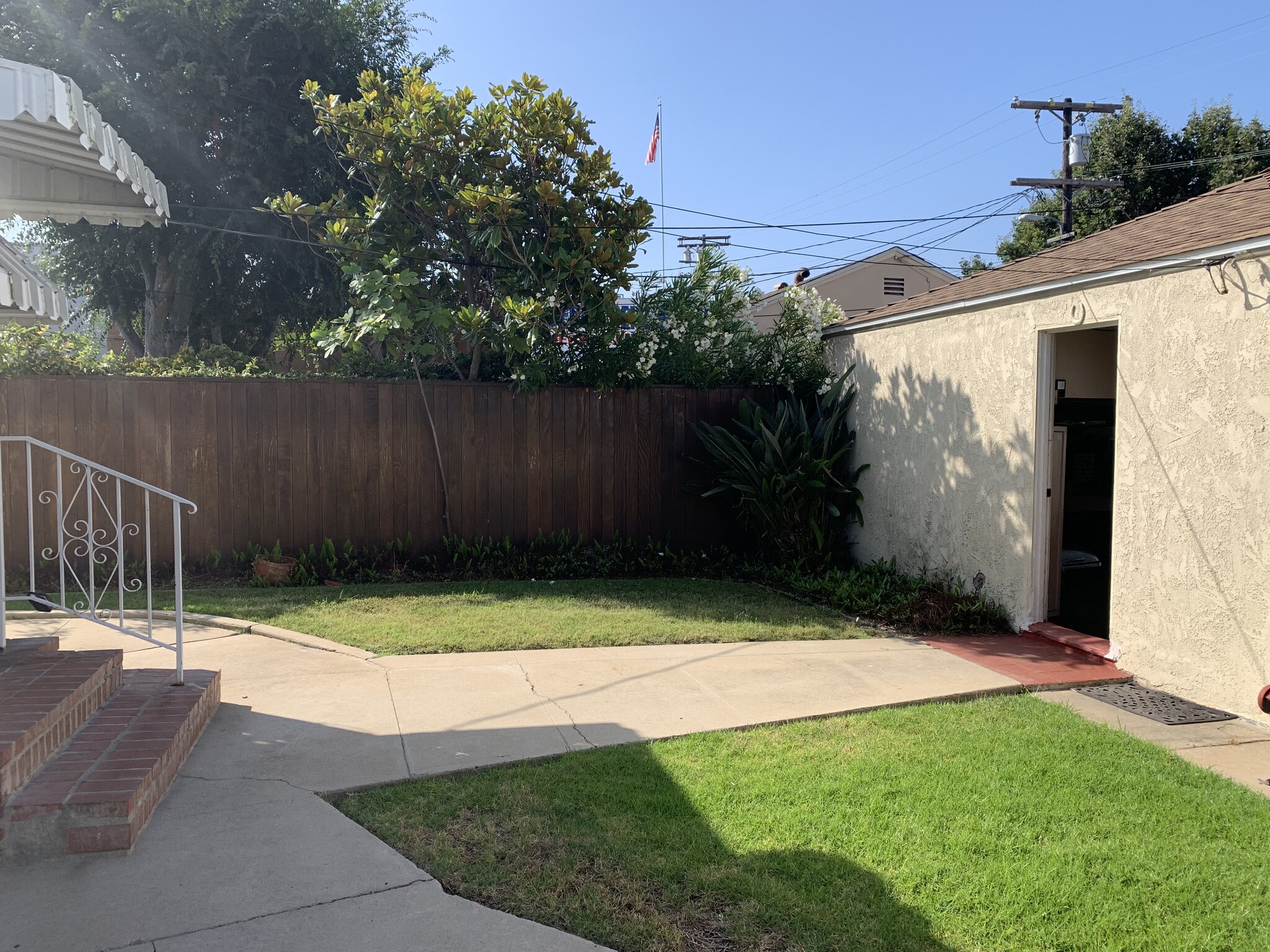 rear door stairs and garage door entry on right - 2935 Westwood Blvd