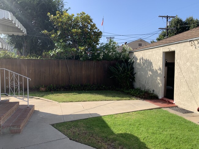 rear door stairs and garage door entry on right - 2935 Westwood Blvd