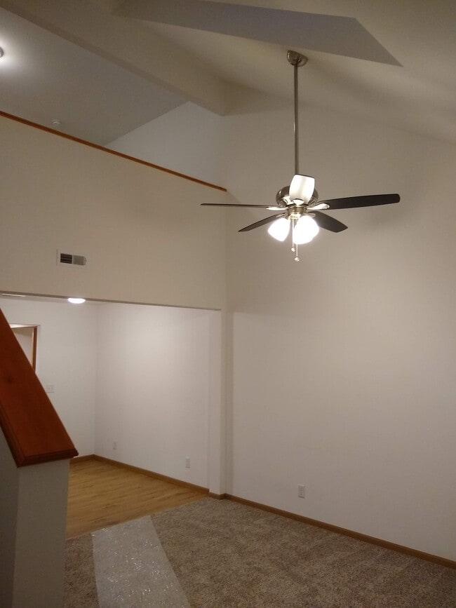 Living room with 1.5 story ceiling and dormer/skylight - Crown Pointe Townhomes - Shiloh