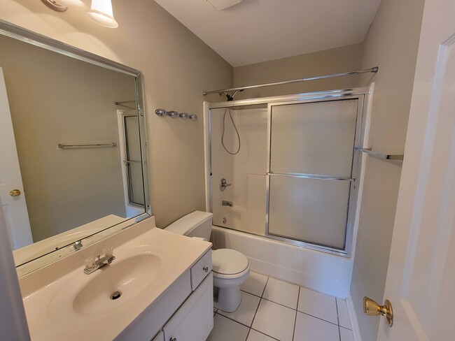 Private bathroom in the second bedroom - 205 Woodstone Dr