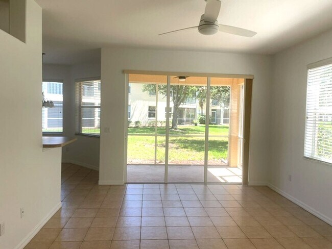 Building Photo - Elegant 3 Bedroom End-Unit Condo with Screened Lanai & Pond Views and A Private Garage