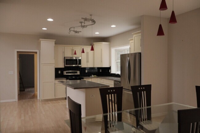 Building Photo - Expansive Mostly-Furnished Residence featuring 3 Bedrooms, a Completed Basement, and a Loft Space