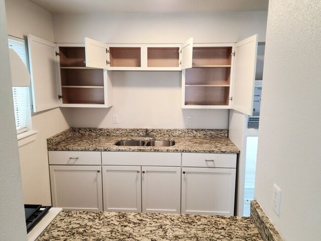 Building Photo - Two bedroom fully remodeled with refrigera...