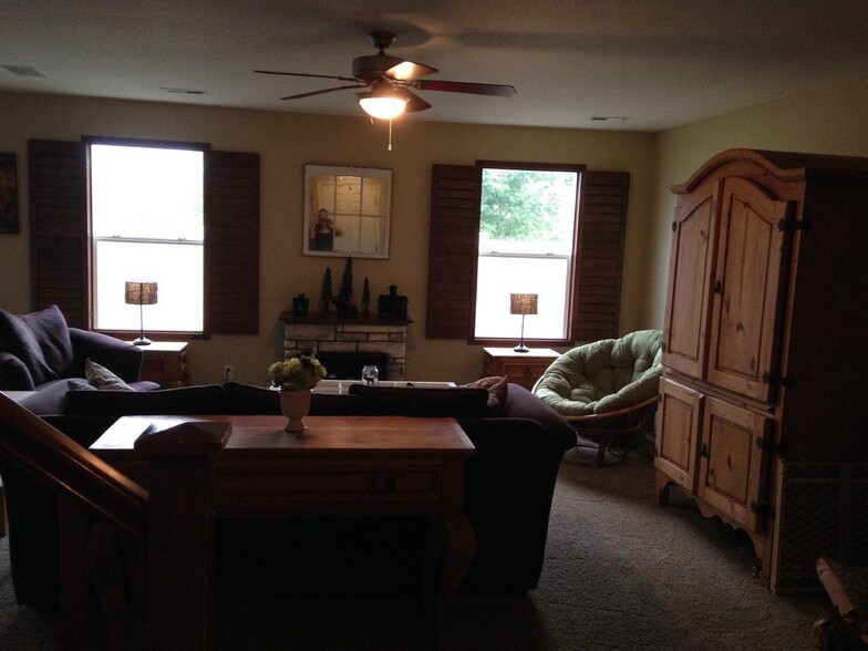 11-Living room with plantation shutters, mountain views - 10653 Butte Dr