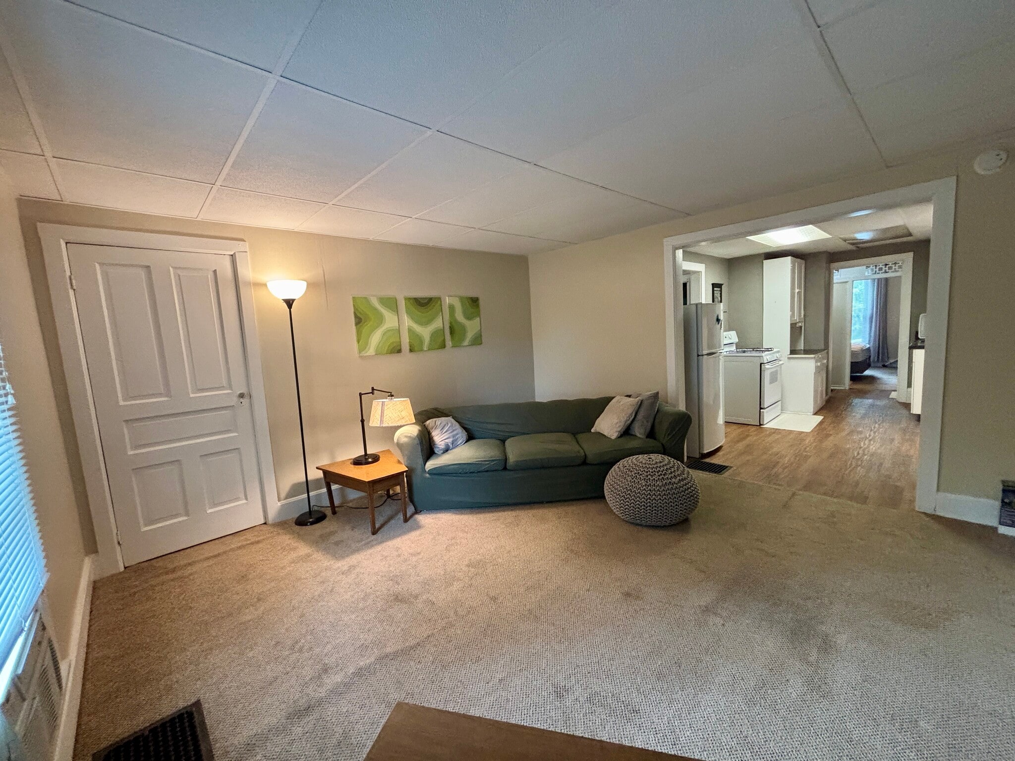Living room, large closet behind door. - 606 Dewey Ave