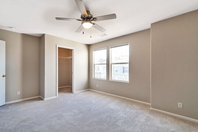 Building Photo - 3BR Townhome Near DIA & Light Rail | New Carpet, Garage & Fenced Patio
