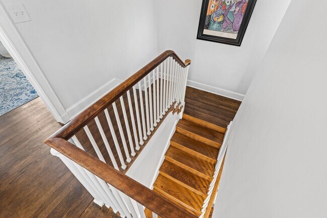 Building Photo - Luxurious Brick Colonial in Prestigious Gu...