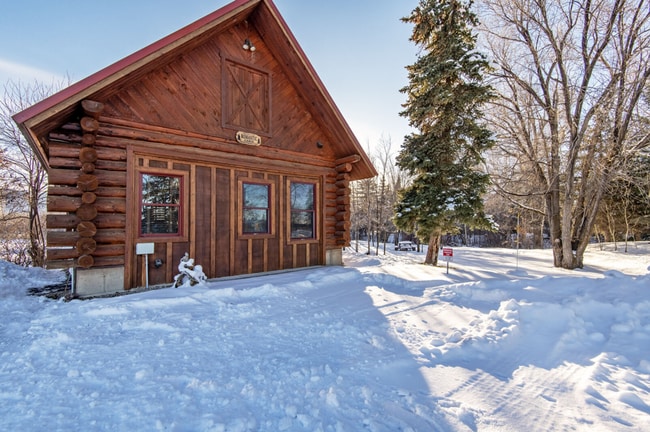 Building Photo - Charming Log Cabin and Carriage House – Do...