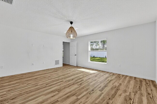 Building Photo - Modern 4-Bedroom, 3-Bath Home with Private In-Law Suite – Palm Coast, FL