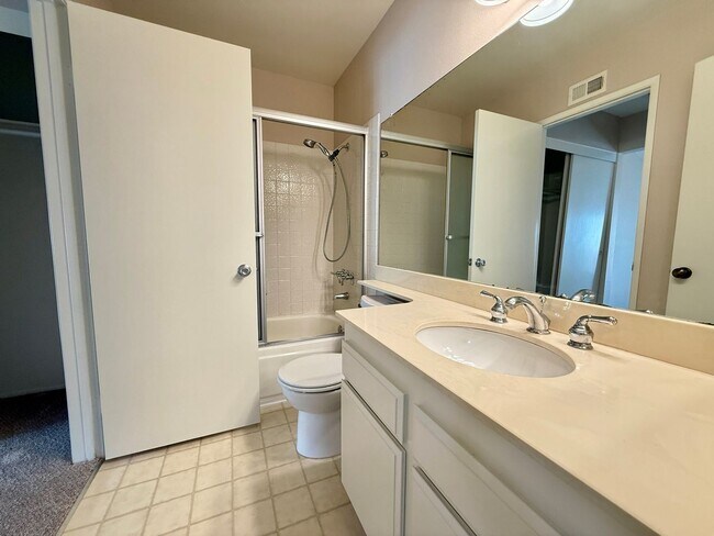 Building Photo - Move in Ready! 2BD Townhome! New Carpet! Two Patio Spaces! Attached Garage!