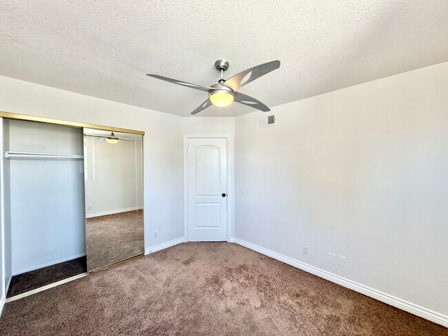 Building Photo - Open-Concept 3 Bedroom 2.5 Bathroom Home with Soaring Ceilings & Spacious Backyard