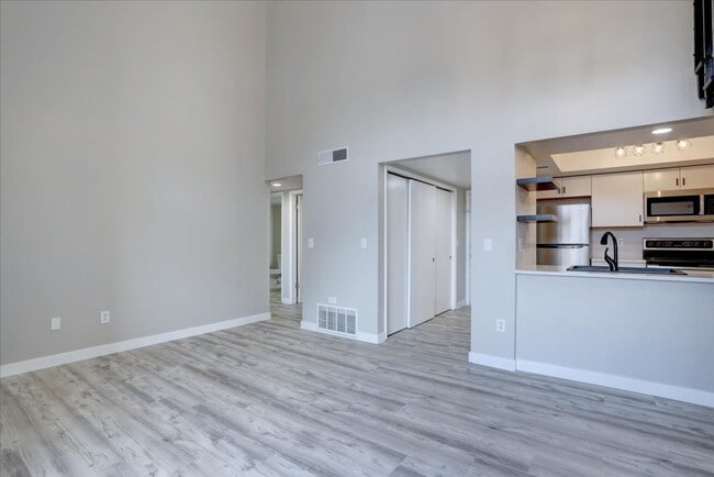 Building Photo - Stunning Top-Floor End Unit with Vaulted Ceilings and Modern Finishes