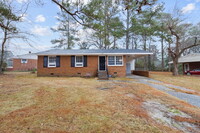 Building Photo - The cozy brick home