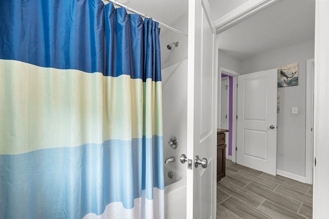 Building Photo - Spacious 6-Bedroom Home with Private Backy...