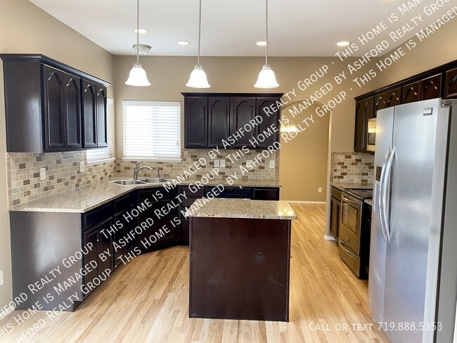 Building Photo - 6667 Snowy Range Dr