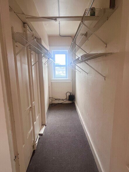Closet located between the living room and bedroom. Very deep and spacious! - 144 Van Zandt Ave
