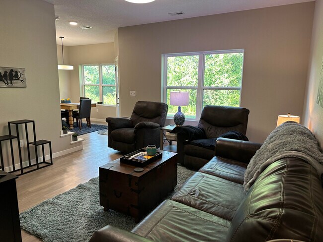 Living room with big windows - 4302 Spruce Creek Dr