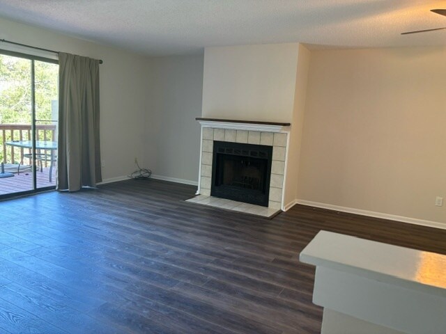 Living room with wood fireplace, access to back deck. - 3913 Whooping Crane Cir