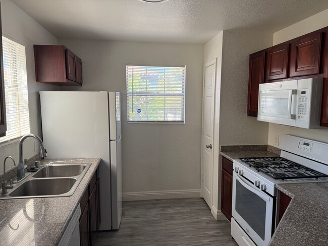 Building Photo - Beautiful 2-Bedroom Condo with Fireplace & Community Pool Near Cheyenne Freeway