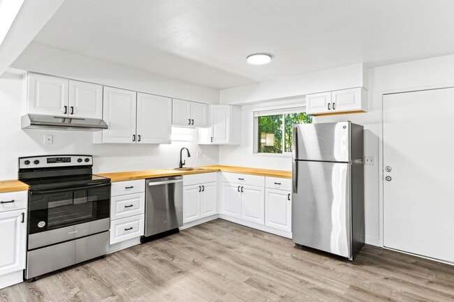 Building Photo - 2BR with dishwasher, on site laundry!