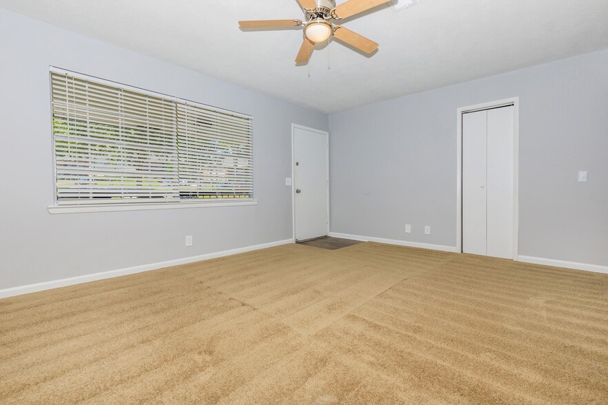 RENOVATED 2BRx1BA: Living room (angle from kitchen entrance) - Woodbend Apartments