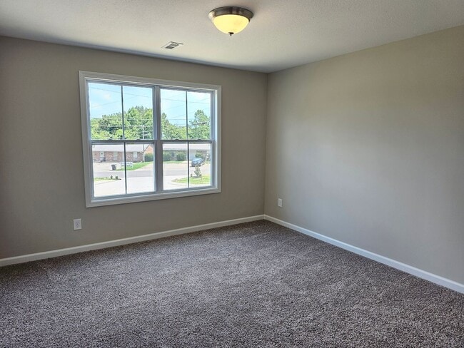 Building Photo - Built in 2024! Close to downtown 2 Bed/2.5 Bath. Nice private backyard with trees