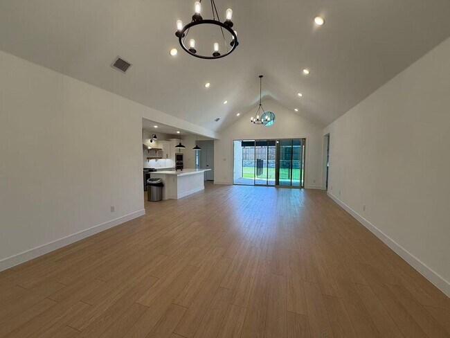 Building Photo - Move-in ready and like-new! Washer, dryer, and refrigerator Included.