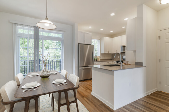 Renovated Package II kitchen and dining area with hard surface flooring - Avalon Northborough