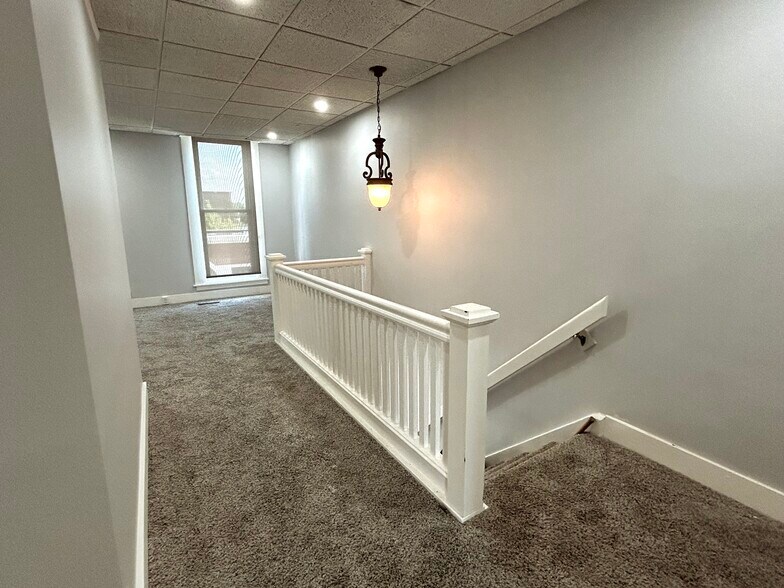 Stairs to upper level hallway - 706 E Main St