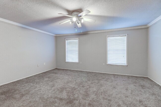Building Photo - Gated Tampa Palms Townhome with 2-Car Garage, Screened Lanai & Community Pool