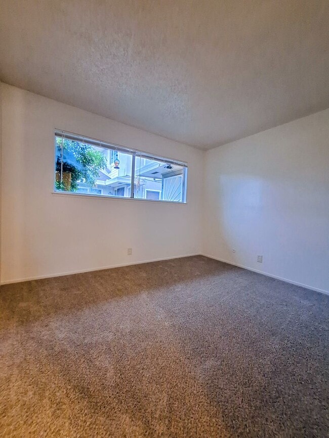 Building Photo - Ground Floor 2bd Condo With On-site Laundry, Carport, & Pool!
