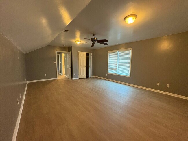 Building Photo - Spacious 4-Bedroom Sanctuary with Cozy Fireplace on Chimney Swift Drive!