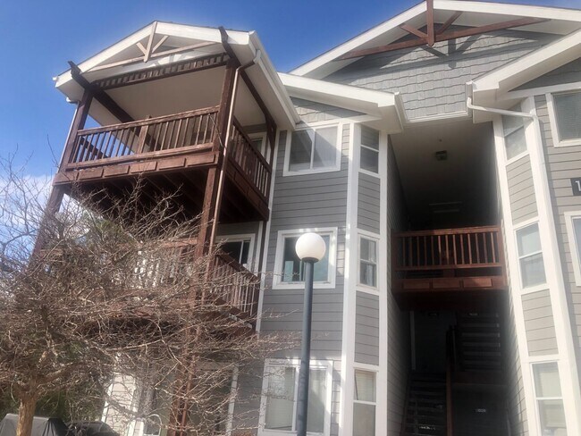 Primary Photo - Top-floor Aurora Condominium with New Carpet