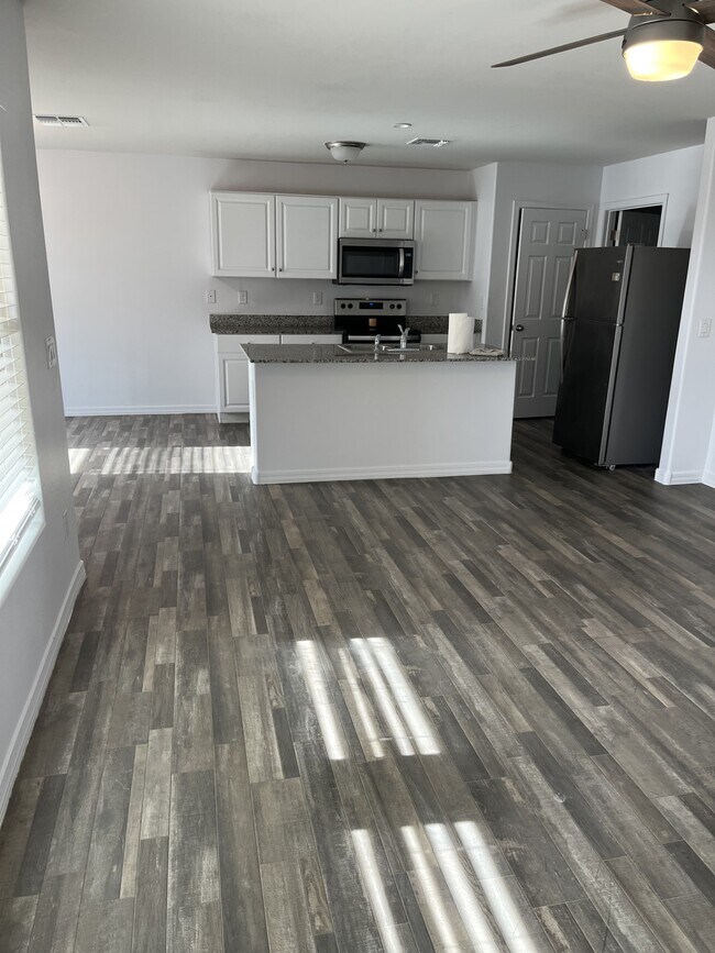 master bedroom is next to great room - 1043 W Seminole Dr